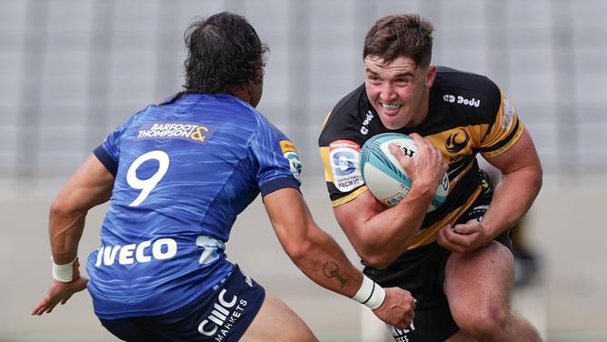 Sam Spink tries to break the line during the Force’s loss against the Blues. 