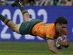 Ben Donaldson flies in for a try in Australia's opening win over Georgia at the World Cup in Paris. (AP PHOTO)