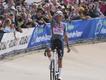 Mathieu van der Poel gestures as he approaches the finish line having earlier been hit by a bottle. (AP PHOTO)