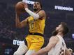 Indiana's Tyrese Haliburton (top) rises to the occasion in the Pacers' win over Cleveland. (AP PHOTO)
