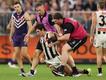 Lachie Schultz attempts to get up after his hit.