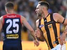 Veteran Jack Gunston (right) kicked three goals in the Hawks' 35-point win over Melbourne.  (Joel Carrett/AAP PHOTOS)